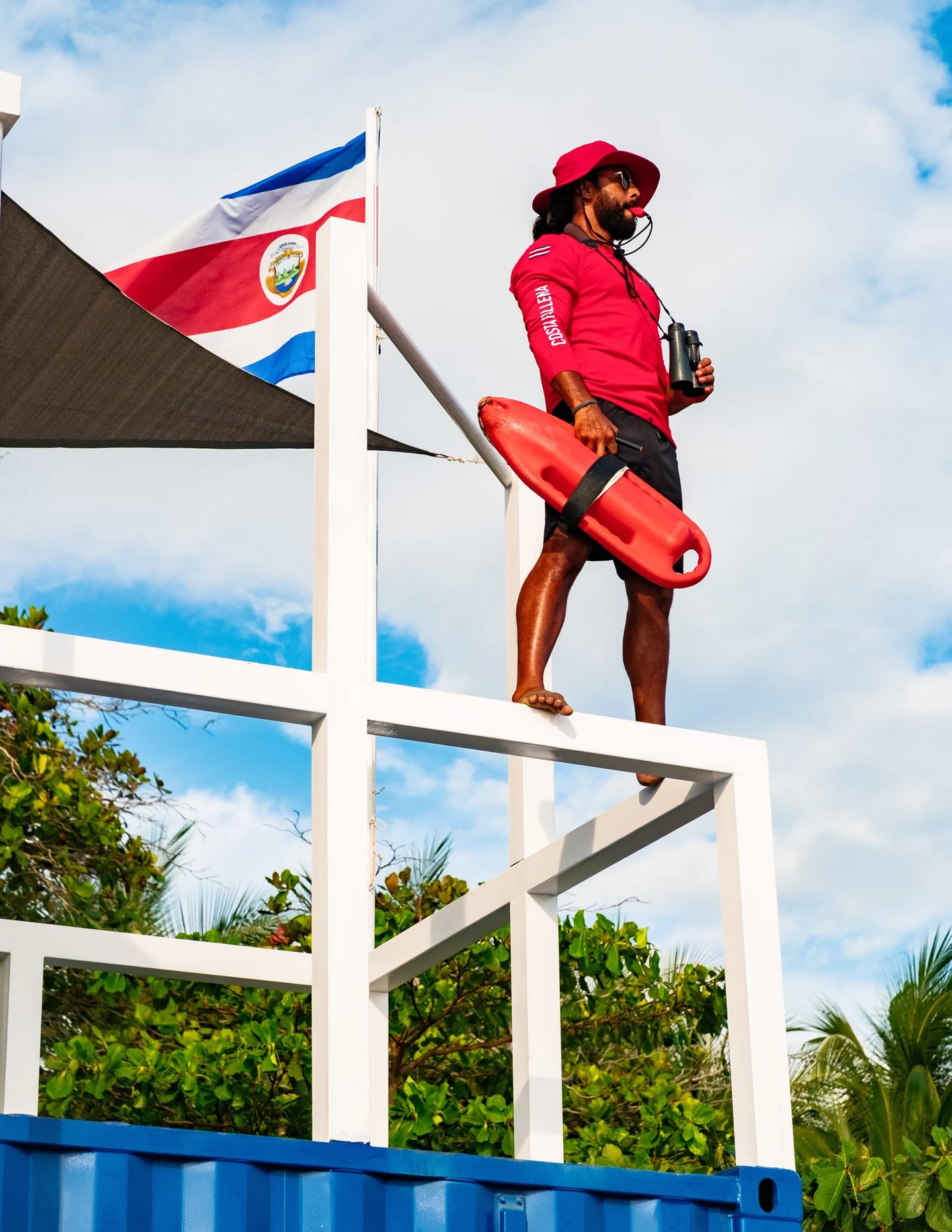 Lifeguard on the observation tower with rescue buoy, Costa Ballena